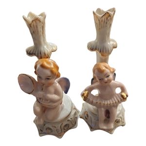 Two Angel Bud Vases. One playing a horn or tuba and the other playing an accordi